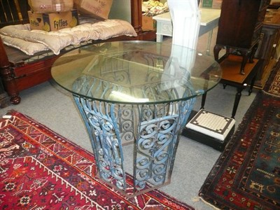 Lot 1611 - Circular glass top table with metal base