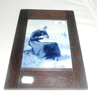 Lot 35 - Oak-framed Delft painted wall plaque of a lady seated by the shore