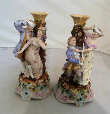 Lot 55 - A pair of Sitzendorf decorative figural candlesticks