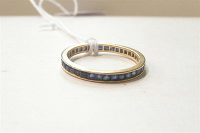 Lot 84 - An 18ct gold sapphire full eternity ring