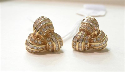Lot 111 - A pair of diamond-set knot earrings