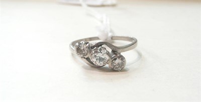 Lot 119 - A diamond three stone twist ring