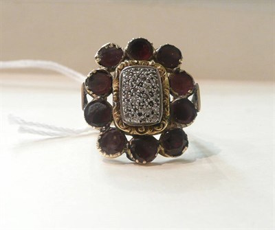 Lot 120 - A garnet (foil backed) buckle converted to a ring