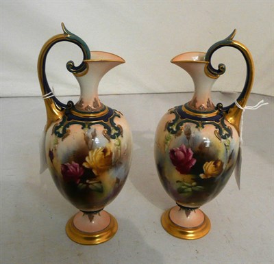 Lot 121 - A pair of Royal Worcester ewers painted with floral sprigs