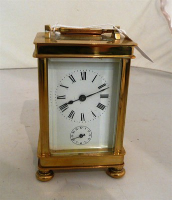 Lot 128 - A brass carriage timepiece with alarm