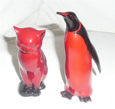 Lot 131 - Doulton flambe penguin and cat
