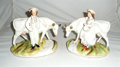 Lot 213 - Pair of Staffordshire cow and milk maid/cow herd groups