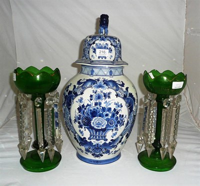 Lot 216 - A pair of green glass lustres and a Delft blue and white vase and cover