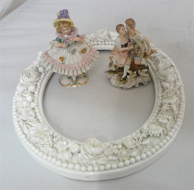 Lot 218 - A Continental porcelain flower encrusted frame and two Continental groups