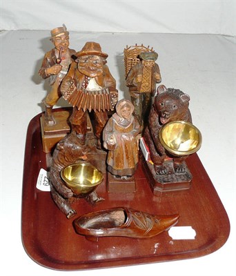 Lot 229 - Two Bavarian carved bear ashtrays, four Austrian carved wood figures and a Russian carved wood shoe