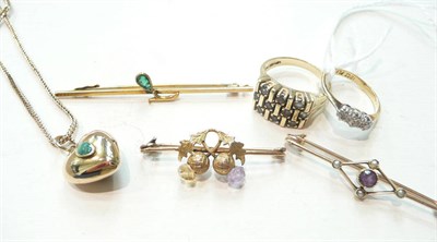 Lot 246 - A diamond three stone ring, a dress ring, three brooches and a locket on chain