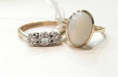 Lot 275 - An opal ring stamped '9C' and a diamond three stone ring