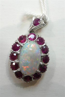 Lot 279 - An opal and ruby cluster pendant