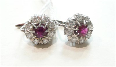 Lot 281 - A pair of ruby and diamond cluster earrings