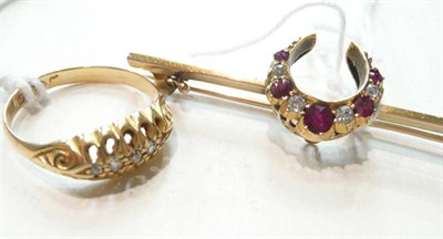 Lot 300 - Gold, diamond and ruby crescent brooch and a gold ring set with diamond chips