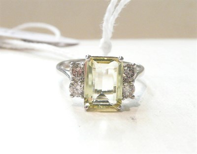 Lot 305 - A 14ct white gold yellow beryl and diamond ring