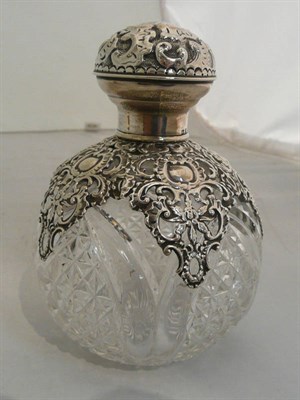 Lot 327 - A silver-topped cut glass scent bottle