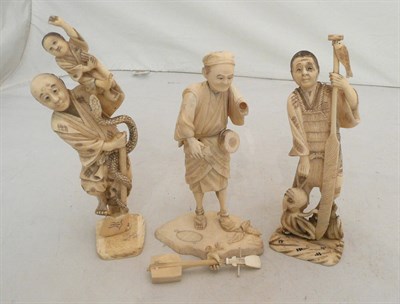 Lot 328 - Three sectional ivory figures - fisherman with octopus, snake charmer and musician