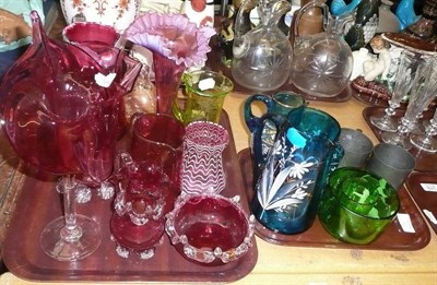 Lot 374 - Cranberry and other coloured glassware on two trays