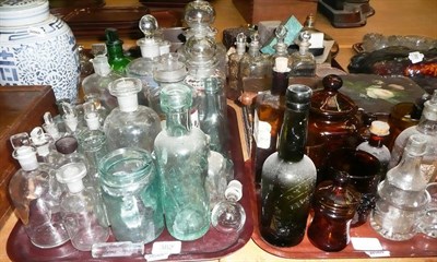 Lot 382 - A quantity of clear, green and amber glass apothecary jars