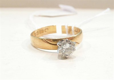 Lot 426 - A diamond solitaire ring on a 22ct gold band (split), 0.75 carat approximately