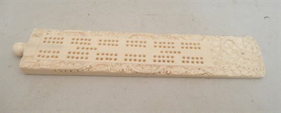 Lot 438 - Carved Indian ivory cribbage board