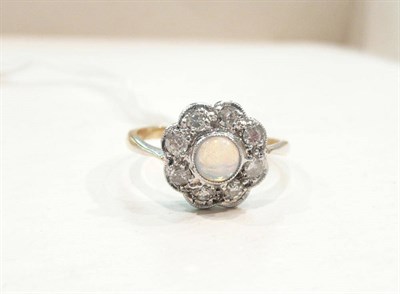 Lot 445 - An opal and diamond cluster ring