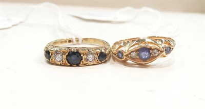 Lot 452 - Two 18ct gold sapphire and diamond rings