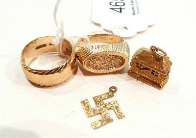 Lot 465 - A 9ct gold band ring, a signet ring, a charm and another