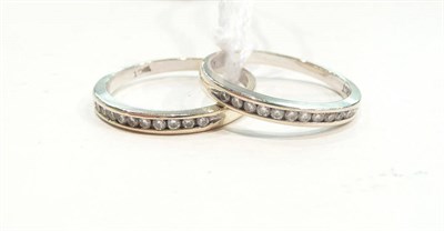 Lot 466 - Two channel set diamond rings, both stamped '18CT'