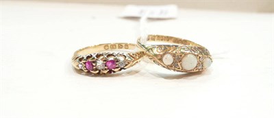 Lot 467 - An 18ct gold opal and diamond ring, and an 18ct gold ruby and diamond ring