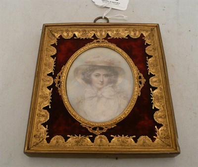 Lot 470 - Miniature portrait of a young lady in an ornate gilt frame