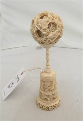 Lot 472 - A Chinese carved ivory puzzle ball and stand