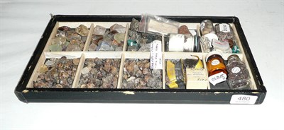 Lot 480 - A tray of rough stones including four bottles labelled 'sapphire', 'garnets', 'corundum' and...