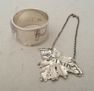 Lot 516 - Victorian silver brandy label and a plain napkin ring