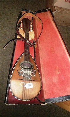 Lot 592 - An Italian rosewood mandolin, cased.