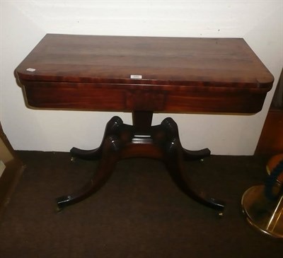 Lot 680 - A Regency mahogany fold over pedestal card table