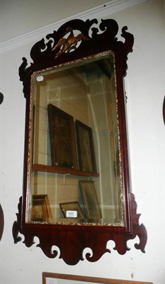 Lot 683 - A Georgian mahogany Chippendale-style fret-cut mirror with gilt eagle