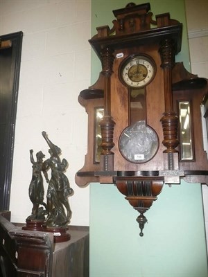 Lot 706 - A Vienna-style wall clock and a pair of spelter figures