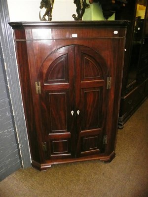 Lot 707 - A mahogany Lancashire floor standing corner cupboard