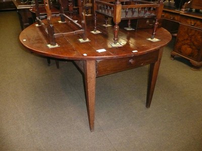 Lot 722 - A French cherrywood farmhouse drop leaf table