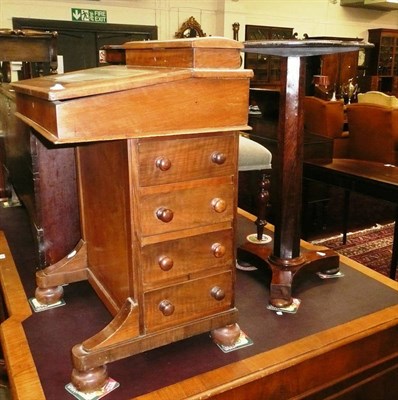 Lot 740 - A Victorian walnut veneered Davenport and a Victorian games top tripod table