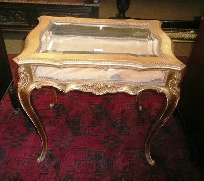 Lot 759 - A 19th century giltwood bijouterie cabinet with serpentine glass sides