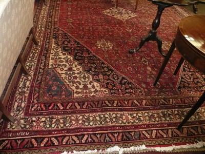 Lot 762 - Hamadan Carpet, West Persia The blood red lozenge shaped field of Herati field centred by an...