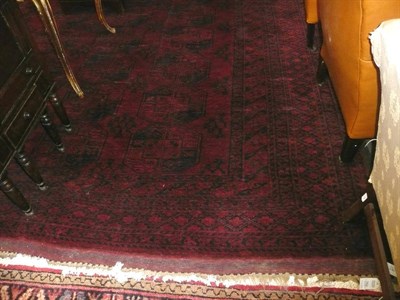 Lot 763 - A large red ground carpet