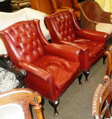 Lot 778 - Pair of small wing armchairs in buttoned brown leather