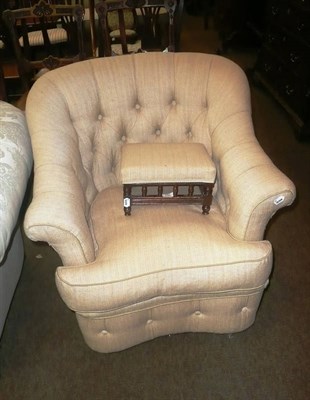 Lot 796 - Buttoned armchair in pale yellow with matching stool