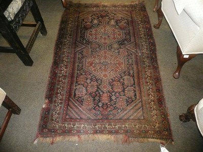 Lot 811 - Afshar Rug, South East Persia The indigo field with two stepped ivory medallions and surrounded...