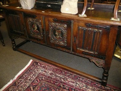 Lot 820 - Large oak sideboard carved with Romayne heads