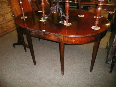 Lot 833 - Mahogany dining table of two D-ends and one leaf with clips